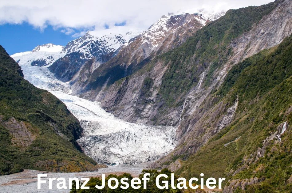 franz-josef-glacier-with-snowy-mountains-in-new-zealand