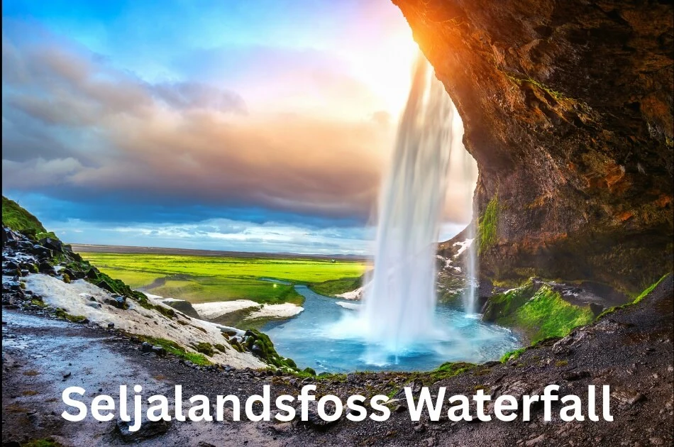 Seljalandsfoss Waterfall in Iceland with stunning sunset view, cascading water, and green landscape
